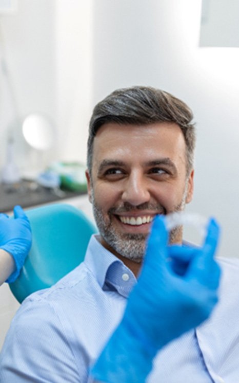 Man in the dental chair getting Candid Pro