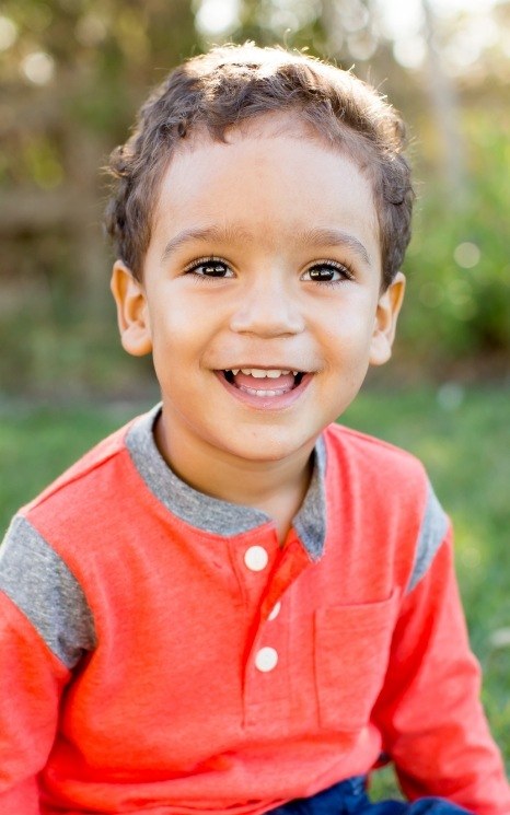 Child with healthy smile thanks to children's dentistry in Burien