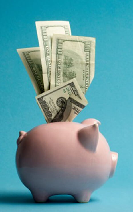 a piggy bank with three hundred dollar bills