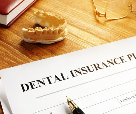 a dental insurance form on a table