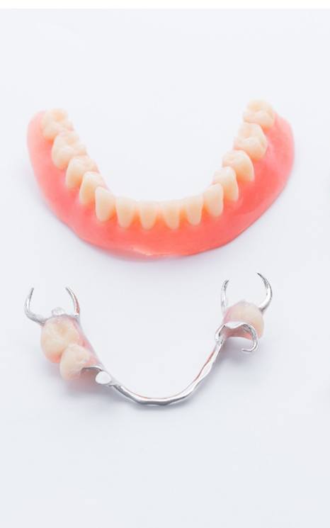 Sets of dentures on a white background