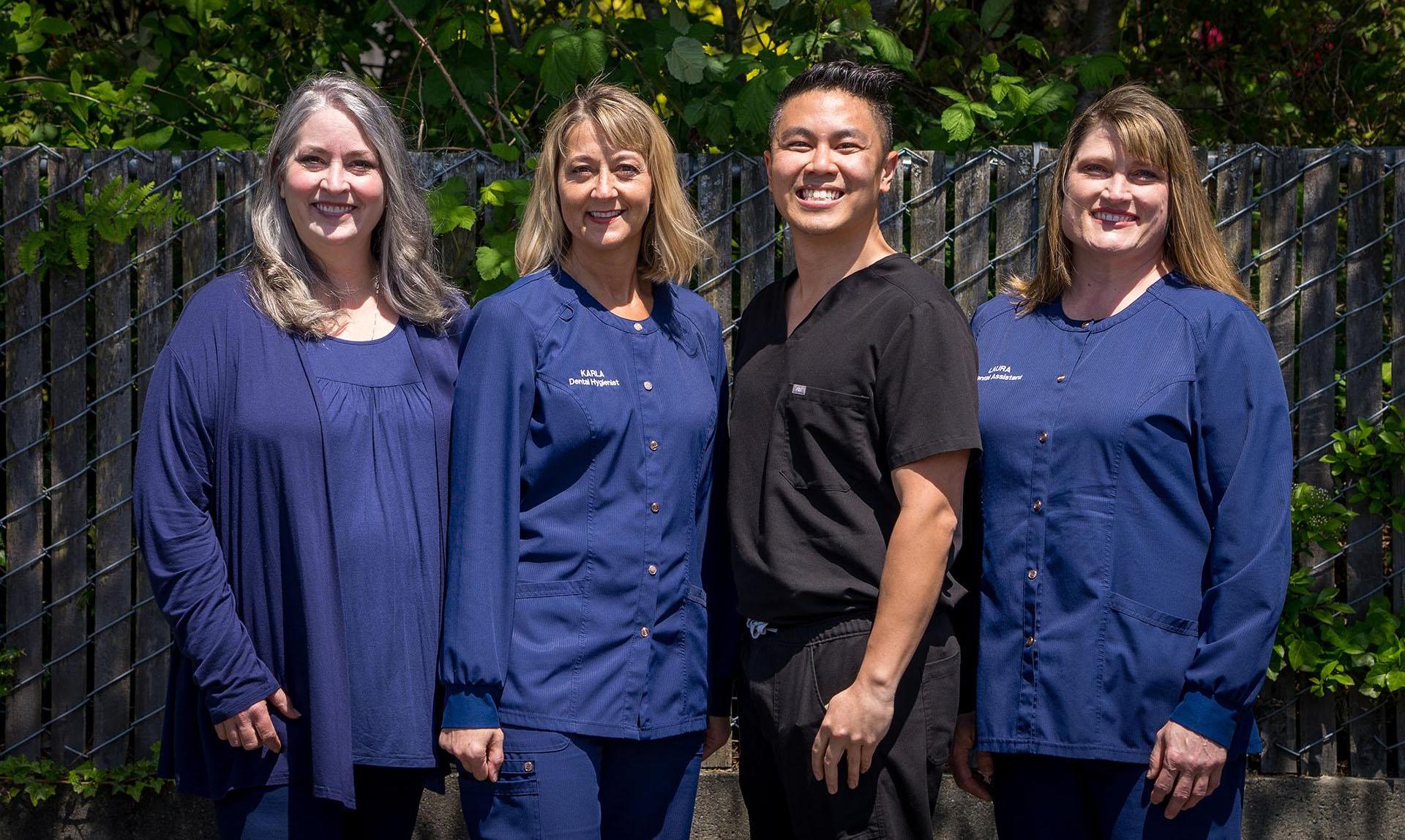The Seahurst Smiles of Burien dentist and dental team smiling outdoors