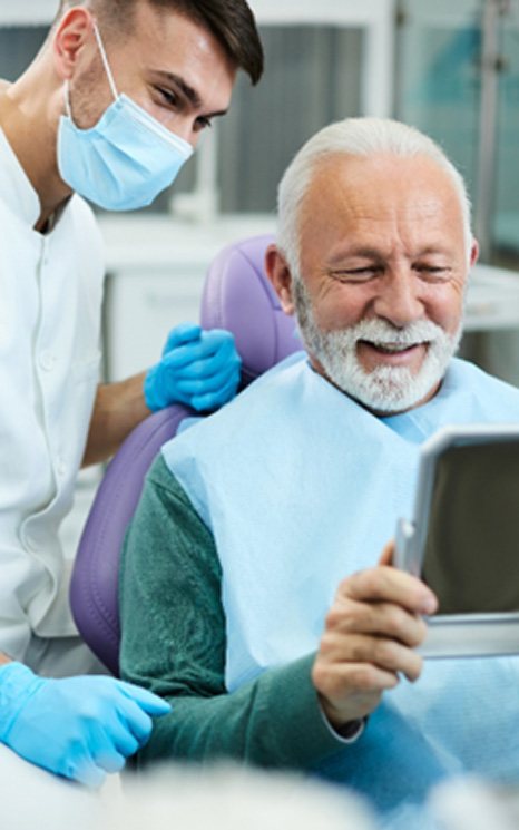 Senior man visiting an out-of-network dentist in Burien