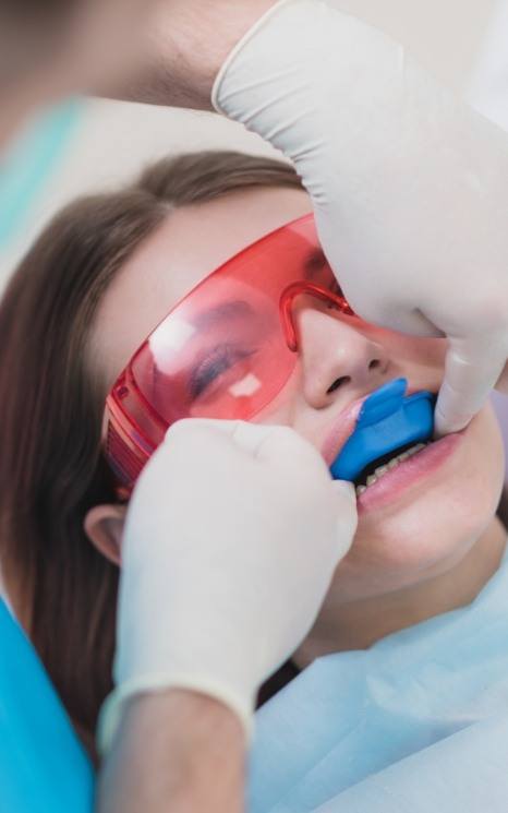 Dental patient receiving fluoride treatment