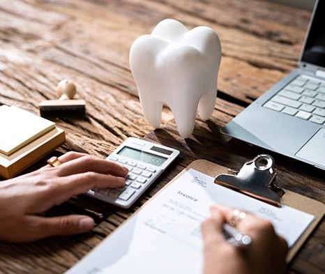 A patient filling out a dental insurance form