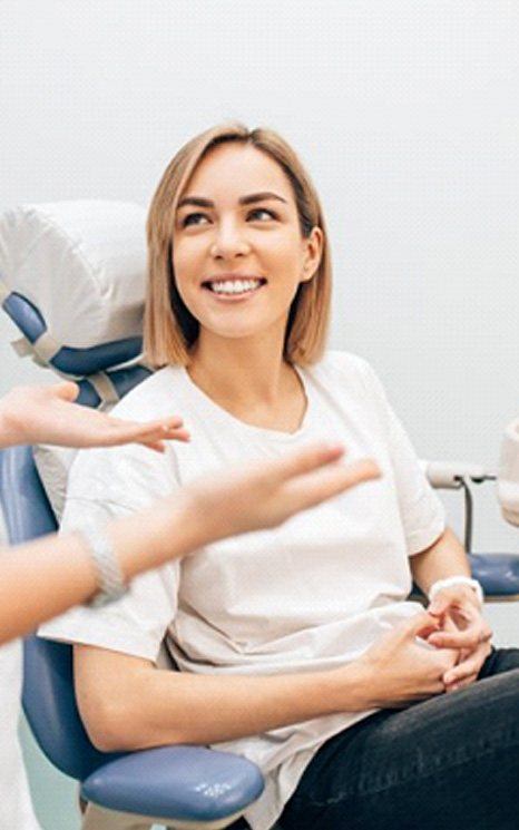 Dentist explains something to her patient