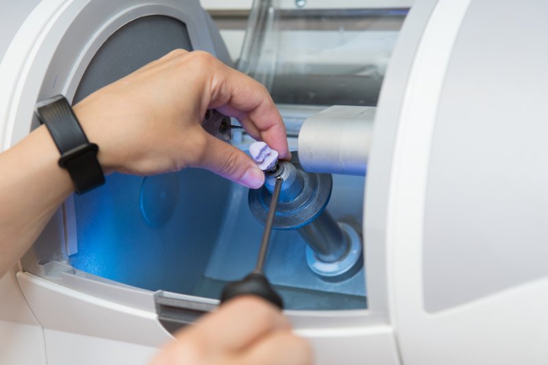 A dentist making same-day dental crowns