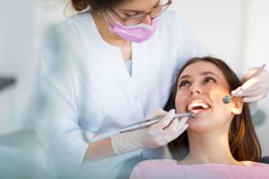 Dentist examining a patient's mouth