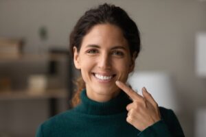 Woman showing off her smile after cosmetic dentistry